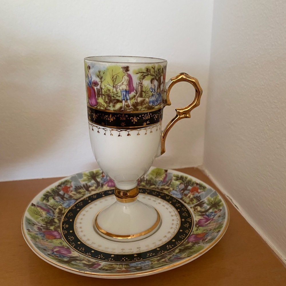 Elegant Gold and White Porcelain Cup and Saucer Set